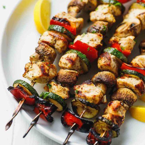Chicken and vegetable grilled skewers with spicy sauce